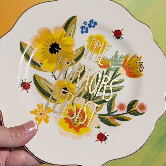 the horrors persist decorative tea plate