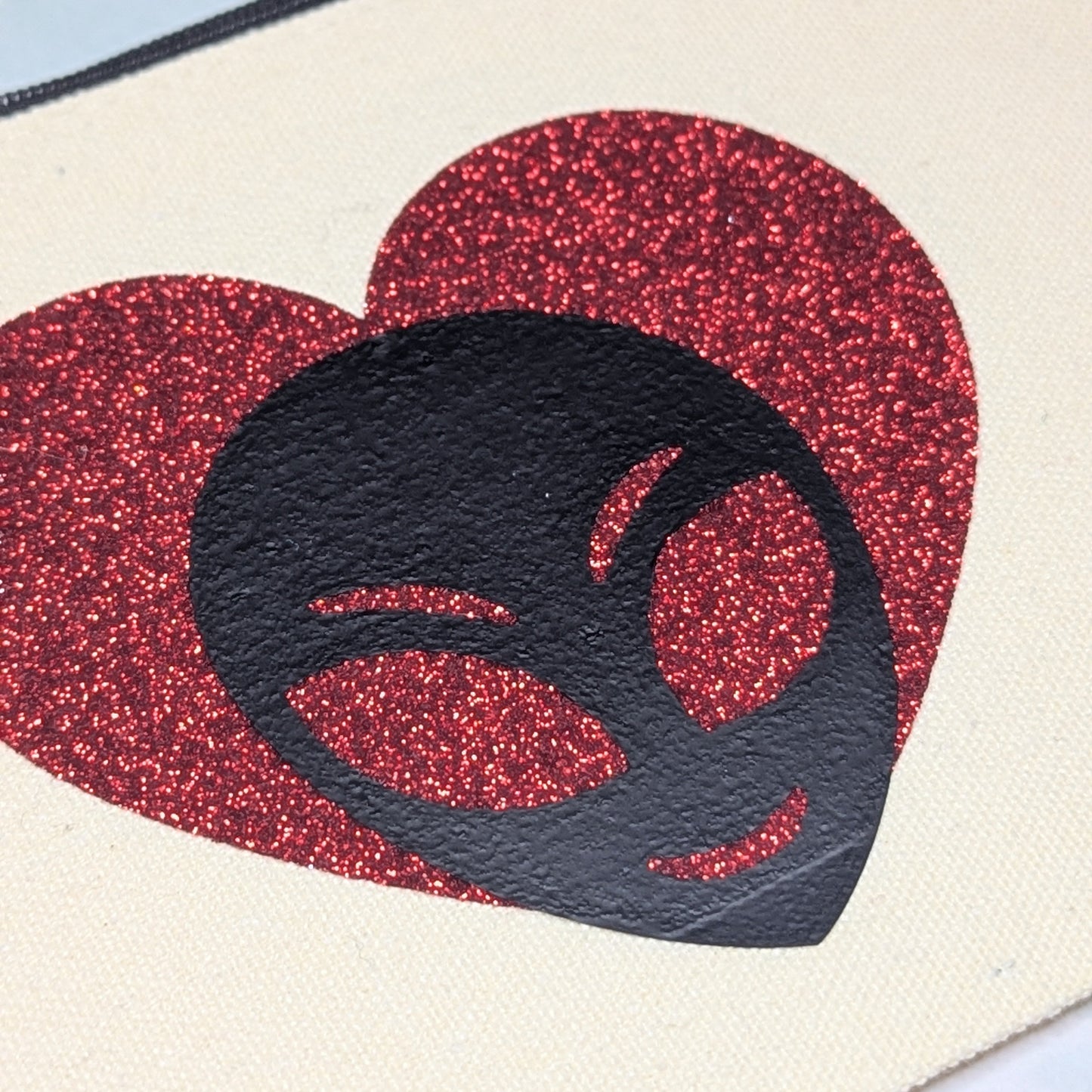 alien love zip clutch