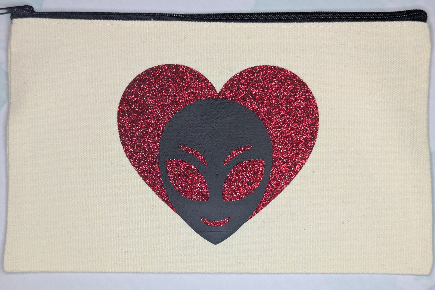 alien love zip clutch